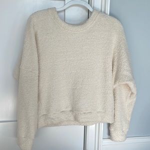 White fluffy sweater.